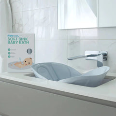 Frida Baby - Soft Sink Baby Bath Seat, Universal Over Sink Bather for Baby, Quick-drying Foldable Baby Bathtub Newborn Spa